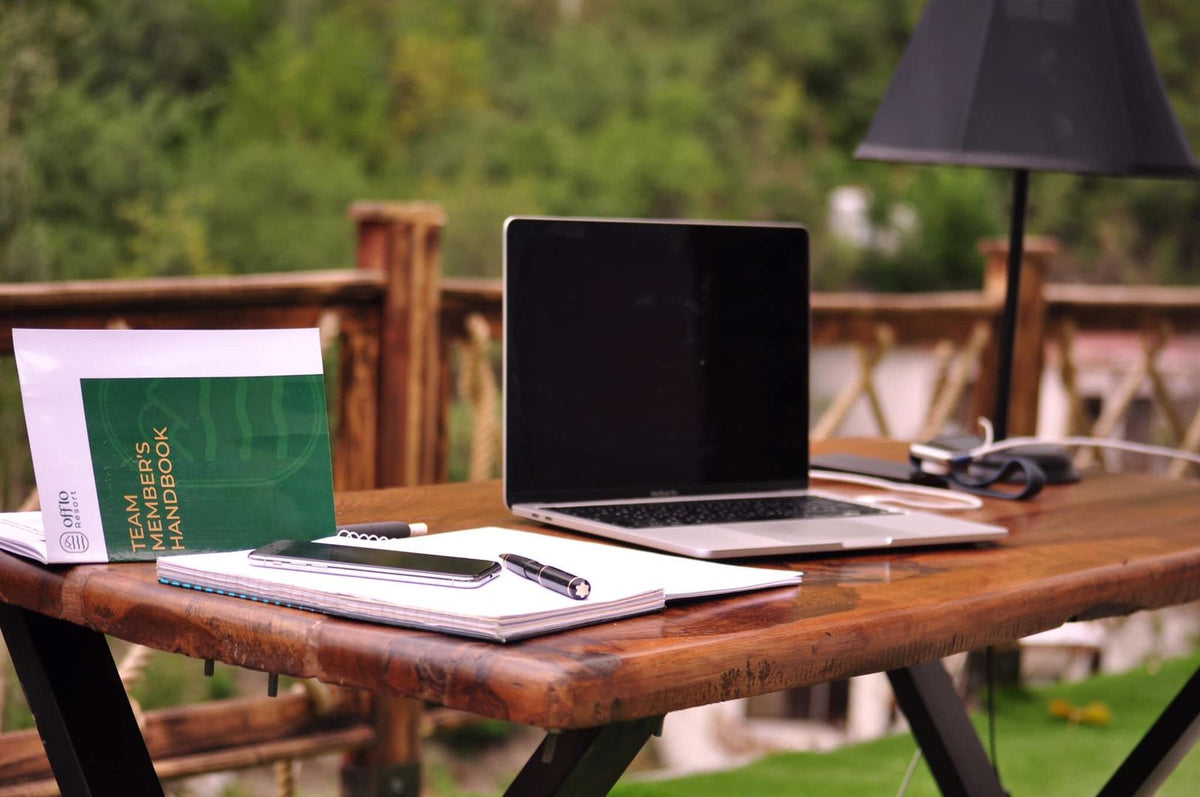 Remote work workstation with laptop showing mountain views at Offto Resort Karimabad Hunza
